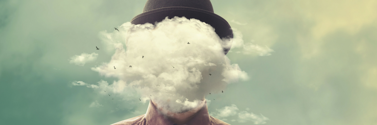 Man's face hidden by a cloud while wearing black hat and red button down