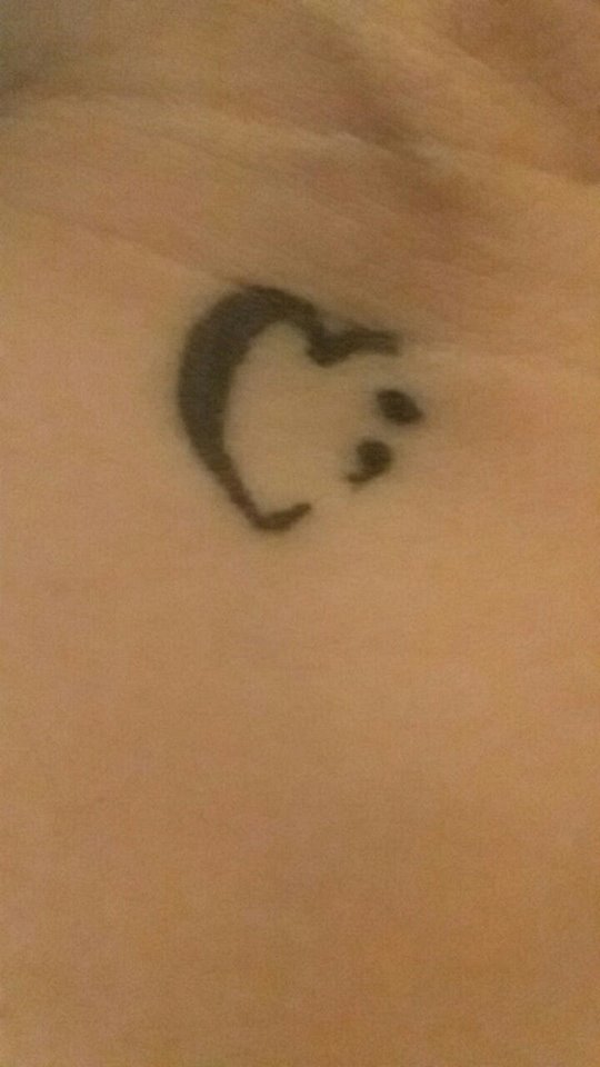 tattoo of a heart with a semicolon