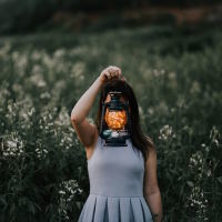 woman with light in front of face