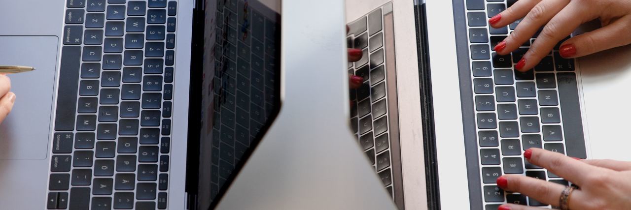 How Early Retirement Caused by MS Gave Me a Second Chance at Life A picture of two people working on their laptops.