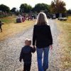mom and son walking at the zoo