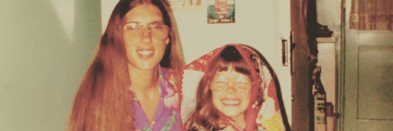 Lessons After My Mom Died by Suicide A young daughter sitting next to her mother.
