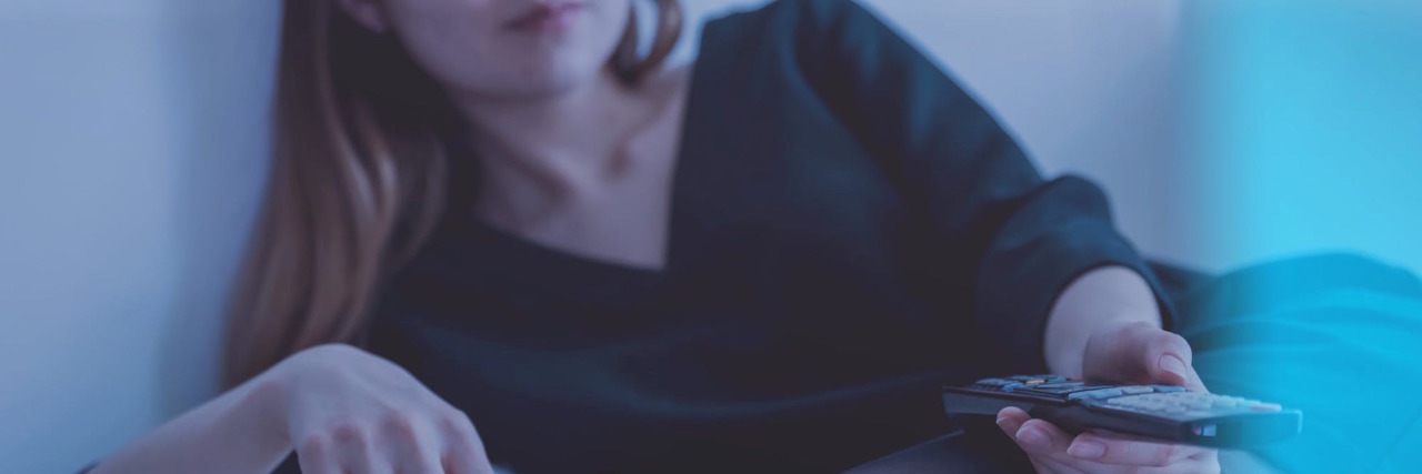 Hyperfixation: What Is It And How Can You Cope? woman watching tv as a hyperfixation technique