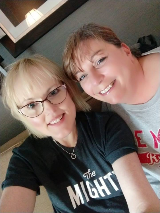 woman wearing "the mighty" t-shirt with friend