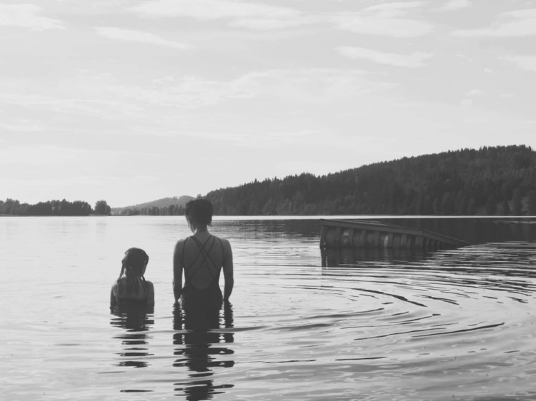 mother and daughter in the lake