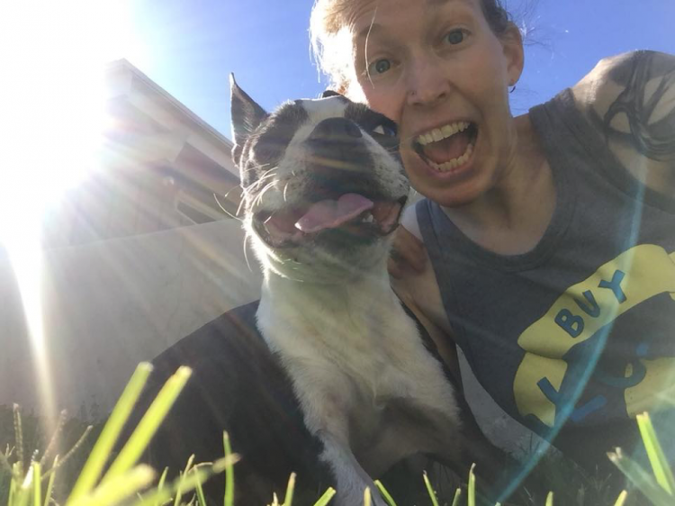 woman smiling with dog