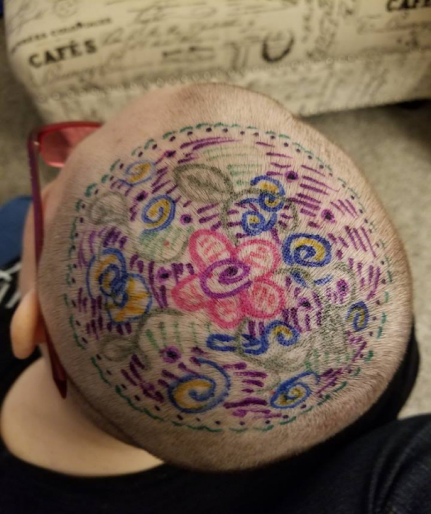 young girl's head decorated with art