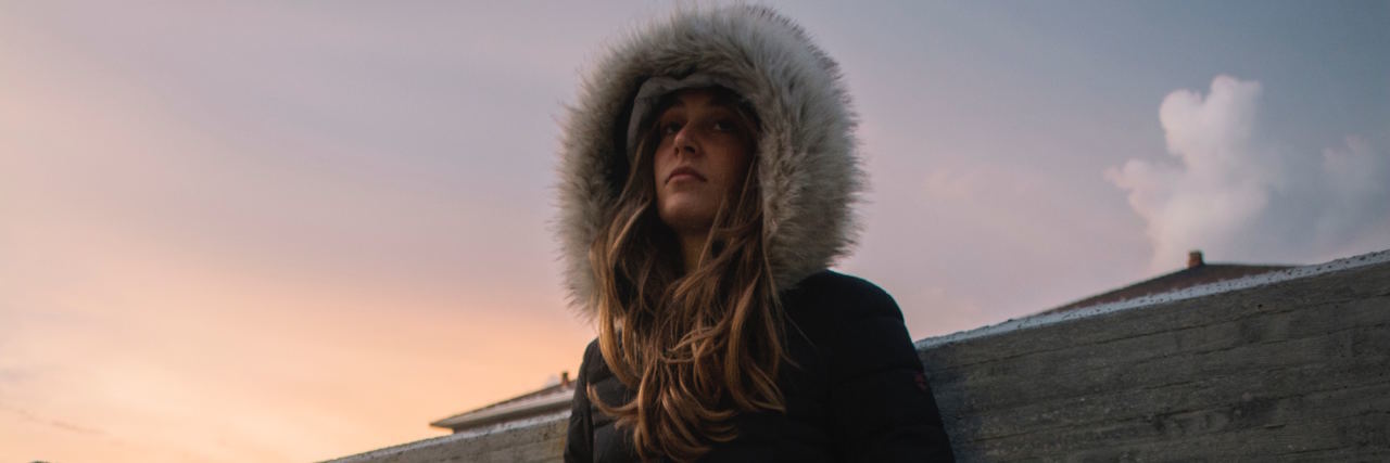 When Your Mental Illness Makes You 'Unlikable' girl with fuzzy hood on