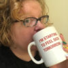 photo of woman drinking from mug which says "I'm starting to feel sick tomorrow"