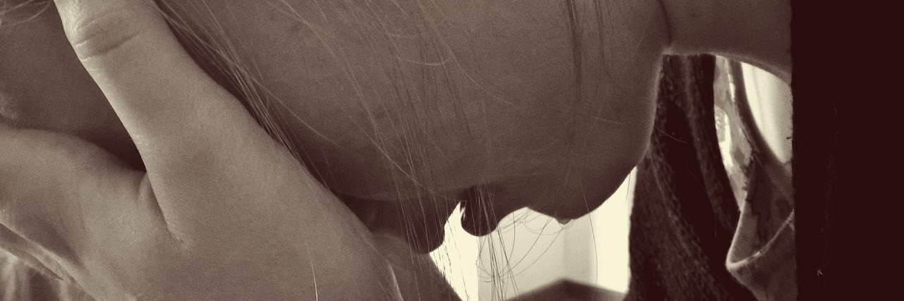 To Anyone With a Mental Illness Who Feels 'Broken' Today sepia photo close up of woman with head in hands crying