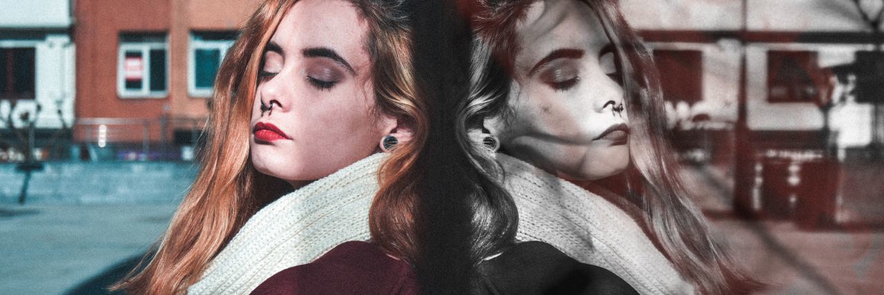 What It Feels Like When Depression and Anxiety Clash woman with back to mirrored glass with one side in color and other black and white