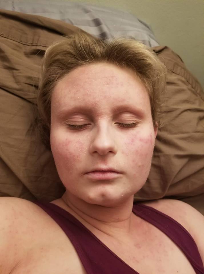 woman lying in bed with her eyes closed