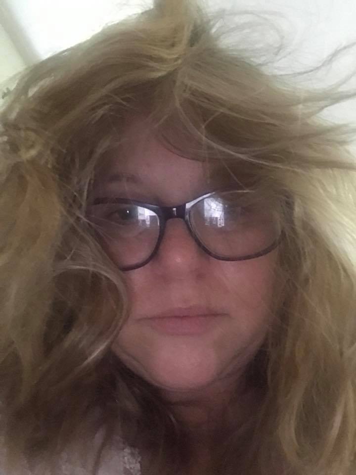 selfie of a woman with hair falling in her face