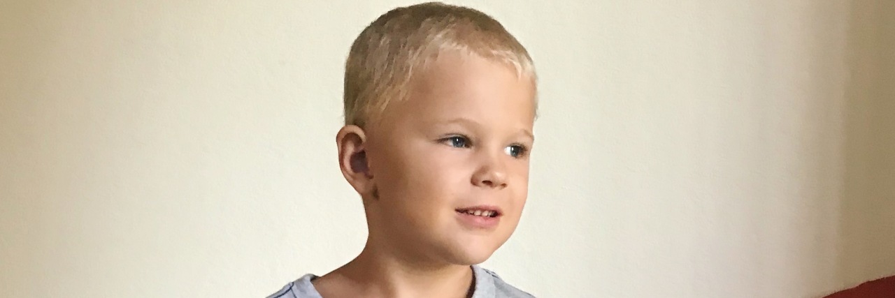 The 5 People You Meet When Your Child Is on the Autism Spectrum Image of little boy wearing grey shirt that reads: "Lover not a fighter."
