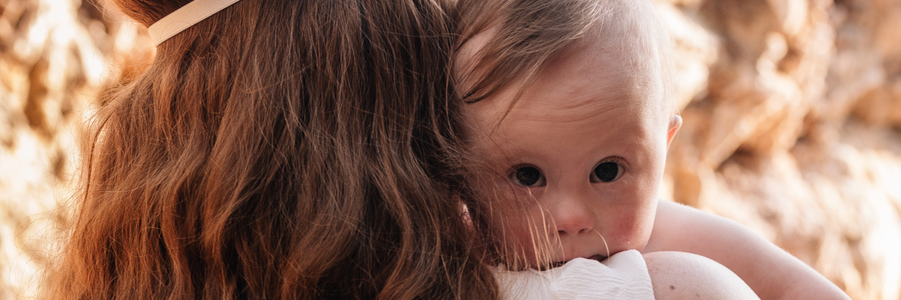 Dear New Mamma of a Baby With Down Syndrome, I See You Mom holding baby with Down syndrome.
