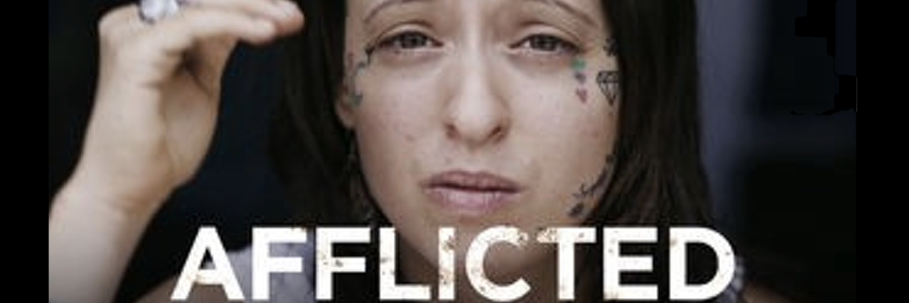 "Afflicted" promo image, shows a white woman with short black hair and bangs.