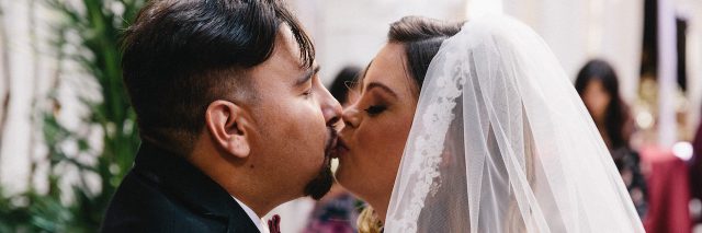 Cristina and Angel close up kiss on wedding day