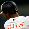 Back of a Baltimore Orioles jersey with orange braille lettering.