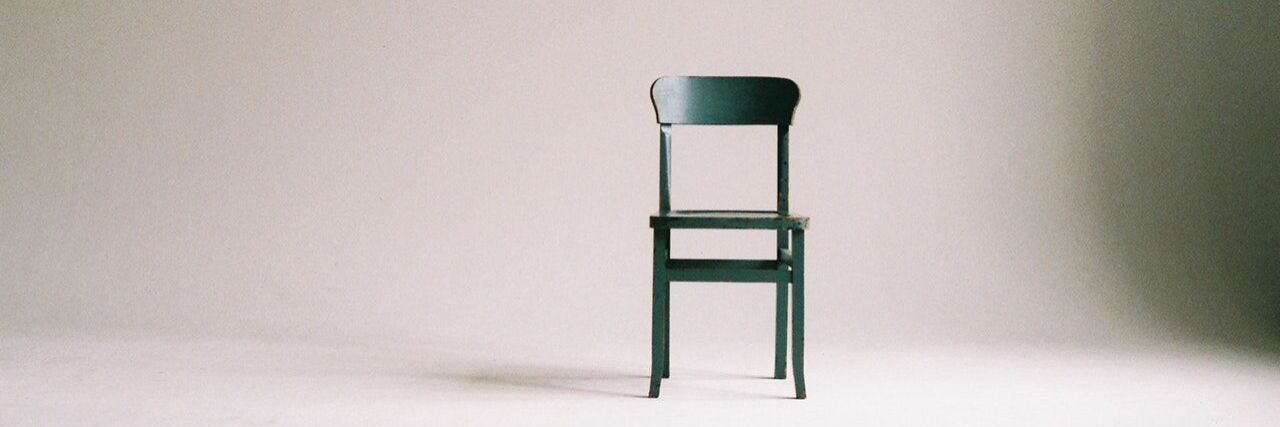 Chronic Pain When Sitting Empty black chair in empty room.