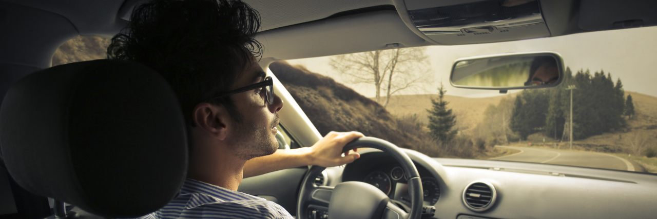 Driving a Car When You Have Autism Man driving a car.