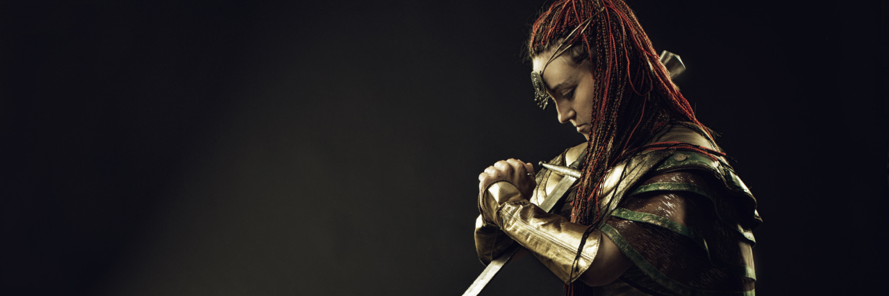 A Letter to Disability Warriors: You Matter Warrior woman kneeling in prayer..