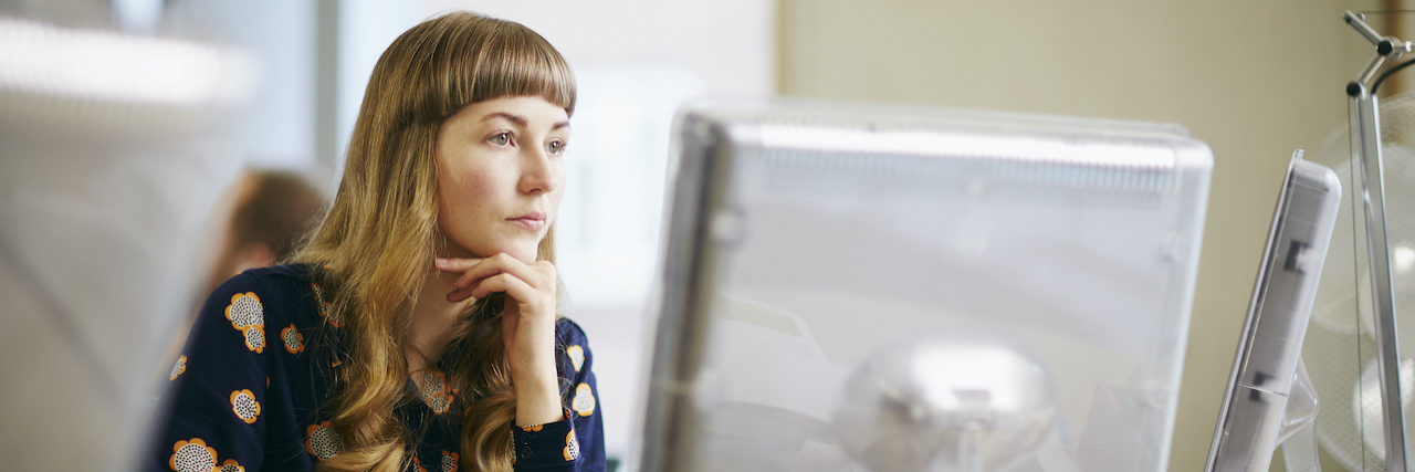 Jobs and Careers for People Living With Ehlers-Danlos Syndrome Woman looking at computer screen