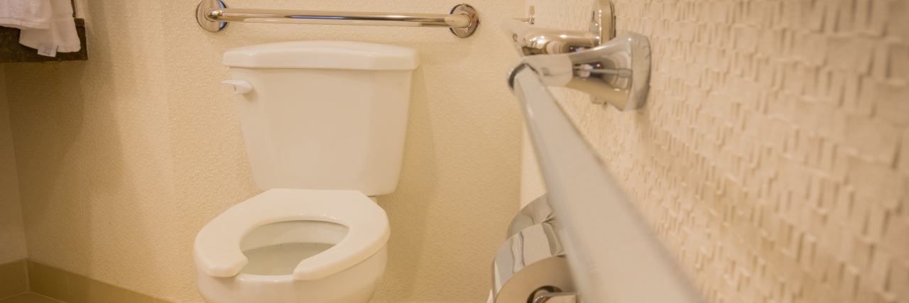 Harmful Effects of Able-Bodied People Using Accessible Restroom Stalls Disabled toilet in bathroom with grab bars.