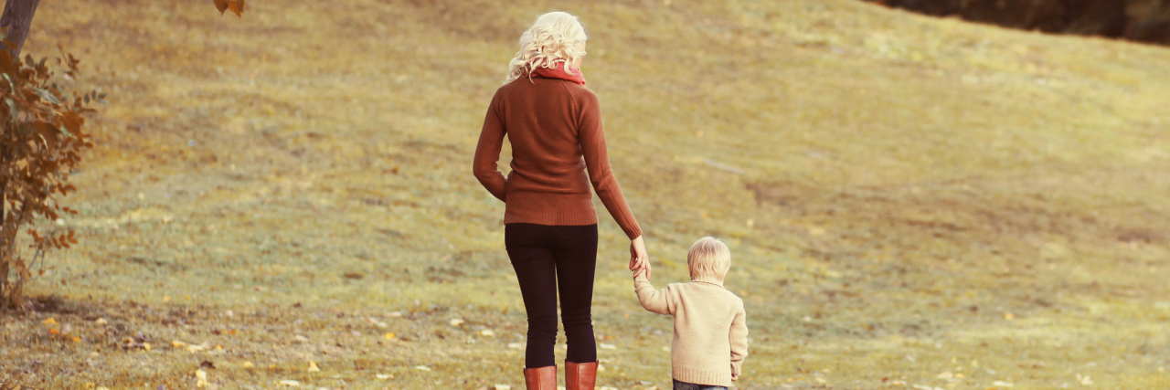 What ‘Quality of Life’ Means for Our Son Who Has Seizures Happy family mother and child walking together in autumn park