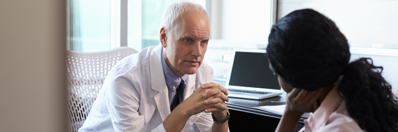 Why Going From Doctor to Doctor Isn't What I Need Right Now A doctor talking to a patient in his office.