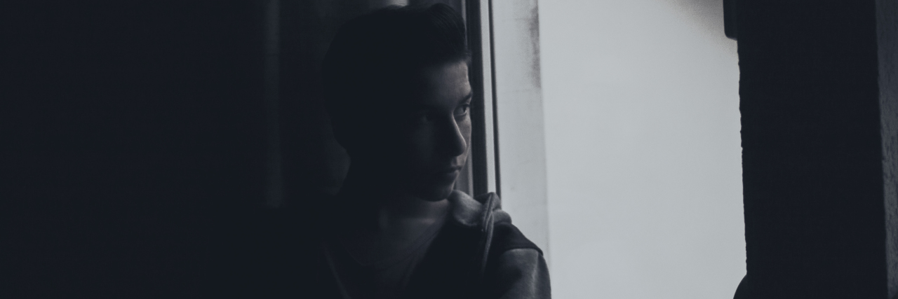 When a Girl My Son Met in Treatment Died From an Eating Disorder a teen boy looking out the window