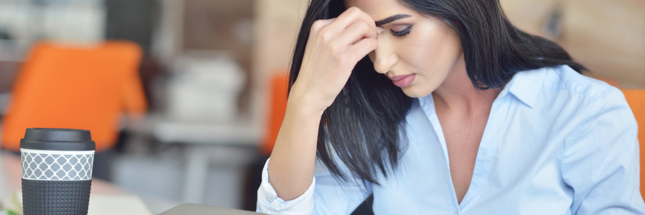 Should I Try Online Therapy? woman looking stressed over a computer
