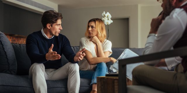 The Shame of Couples Therapy Couple arguing during therapy session with psychologist