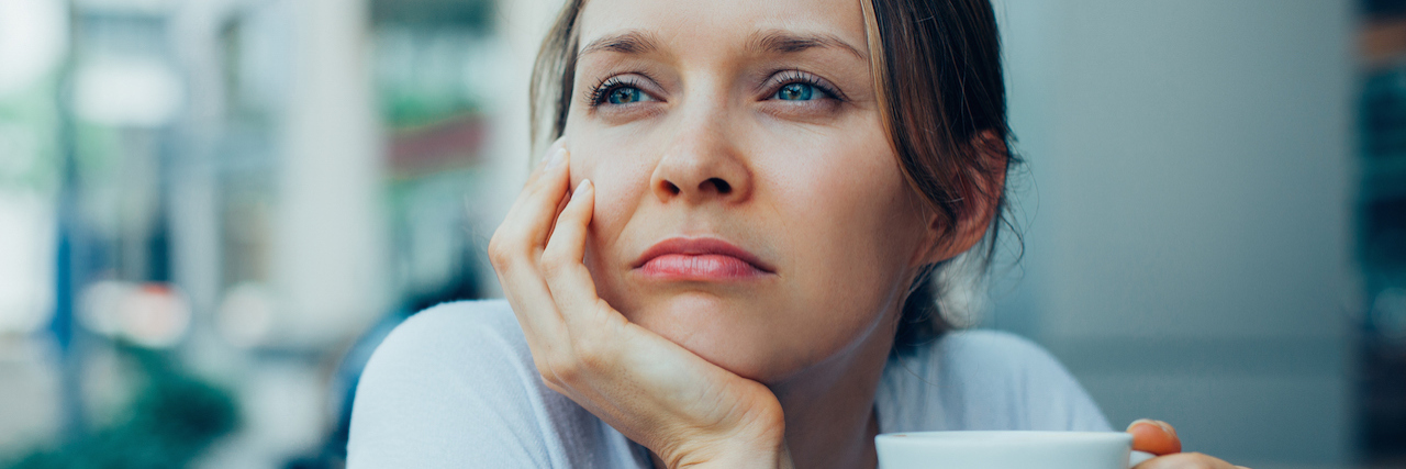 To the Friend I Lost Because of My Mental Illness A woman holding a cup of tea