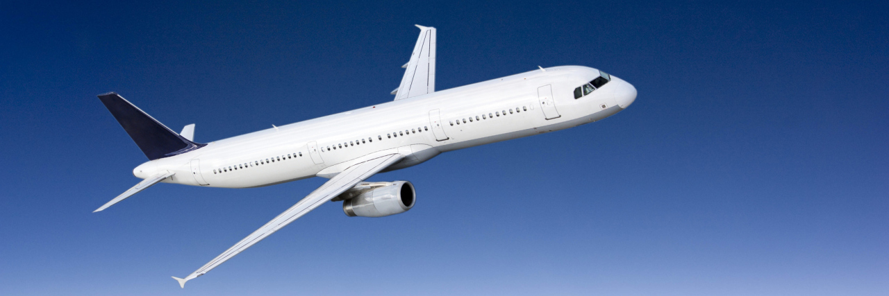 Airport Apologizes After Teen Told Her Insulin Pump Could Crash Plane Plane flying above clouds