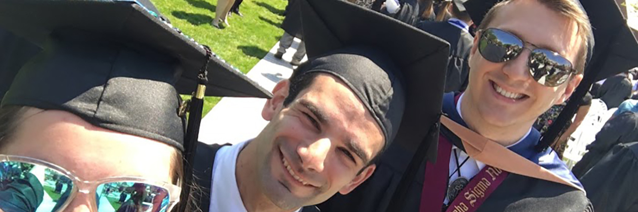 Starting the School Year With Epilepsy Kyle in his graduation cap and gown, with friends.