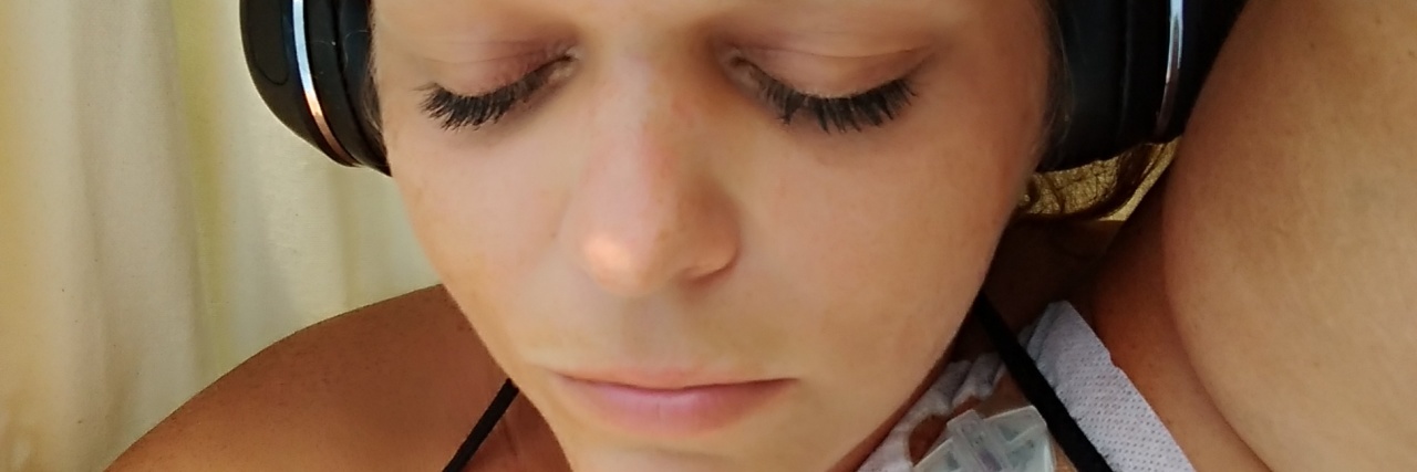 21 Songs I Cling to Because of Lyme Disease A photo og the writer showing a picture of her tattoo on her arm that reads, "This too shall pass."