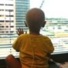A boy looking out a hospital window