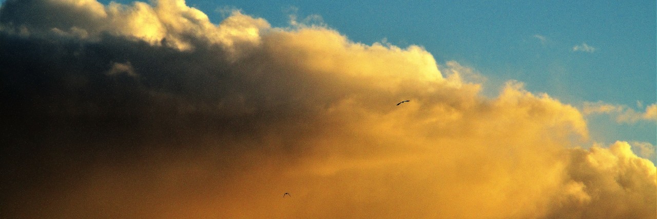 The Importance of Having Self-Compassion Before Practicing Self-Care sunset in the clouds