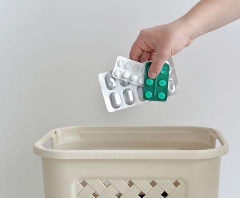 pills being placed in laundry basket