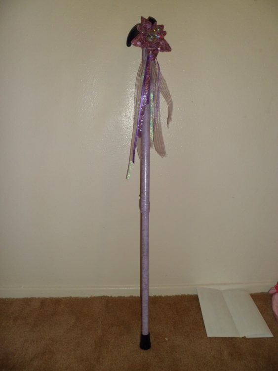 Cane decorated in the style of a homecoming mom