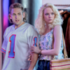 Still of Jonah Hill and Emma Stone in Maniac. Hill is wearing a jersey and Stone has 80s style hair curls.