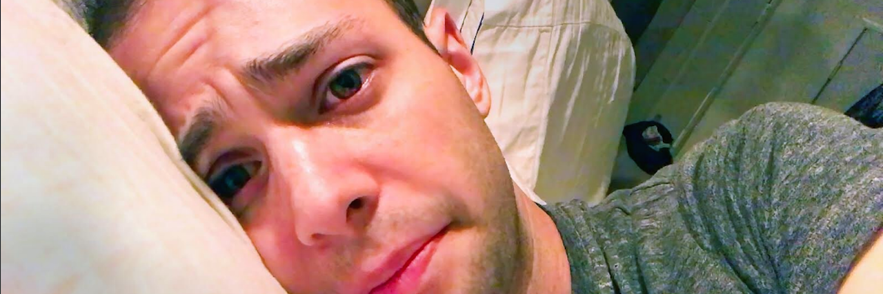 Why Zach Kornfeld's Video Is Critical for Chronic Illness Awareness A photo of Zach, looking as though he doesn't feel well.