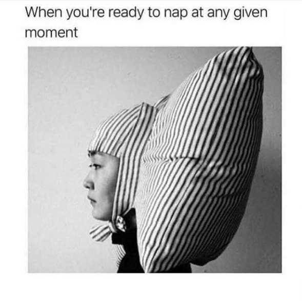when you're ready to nap at any given moment: woman wearing a pillow attached to her head