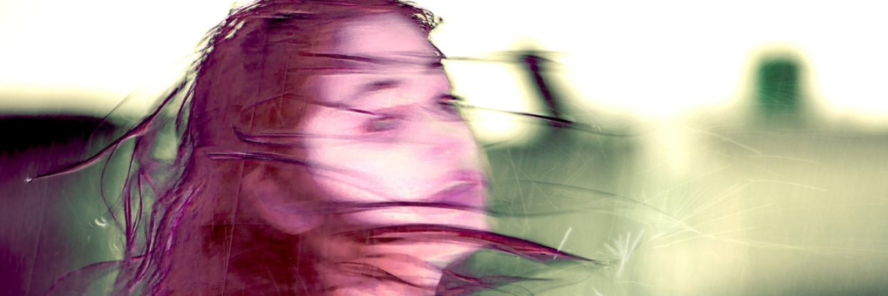 17 'Harmless Comments' That Actually Hurt People Who Are Suicidal A woman, blurry, and tossing her hair over her shoulder. Text reads: 17 harmless comments that hurt people who are suicidal