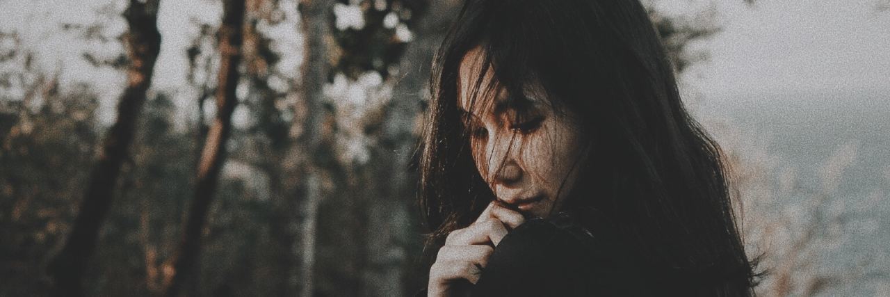 Because of What You Have Been Through, You Are Mighty A picture of a woman outside.