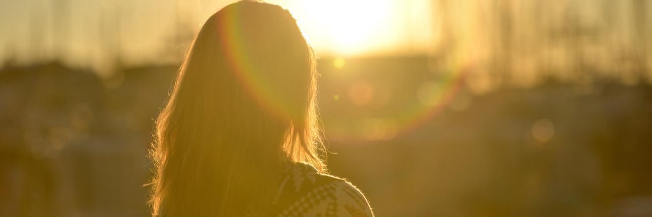 sunset photo of woman outside in silhouette