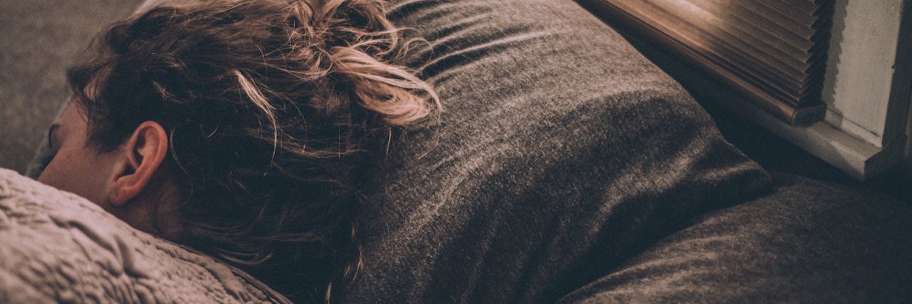 What a Morning Is Like With Mental Illness A woman lying in bed
