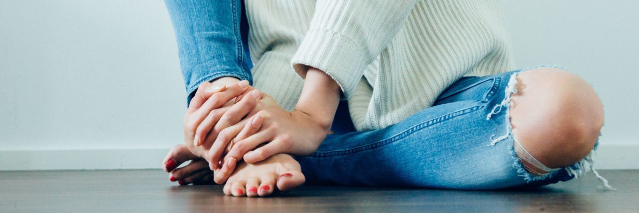 What to Know Before Starting EMDR for Trauma Therapy photo of woman sitting on floor in bare feet