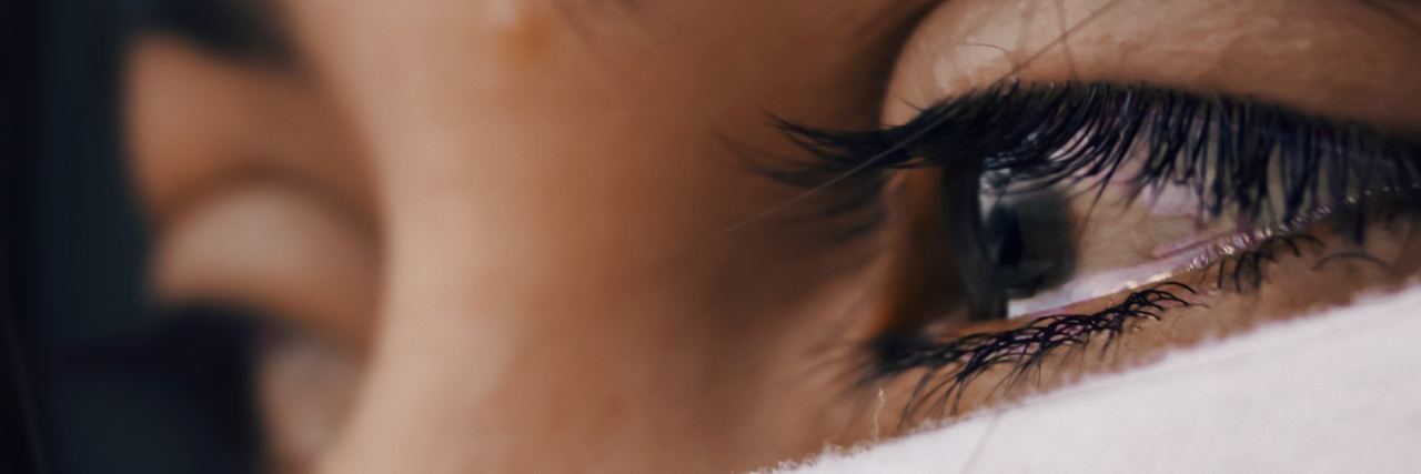 What Doctors Need to Understand About Chronic Pain and Anger close-up of woman's eyes as she's crying