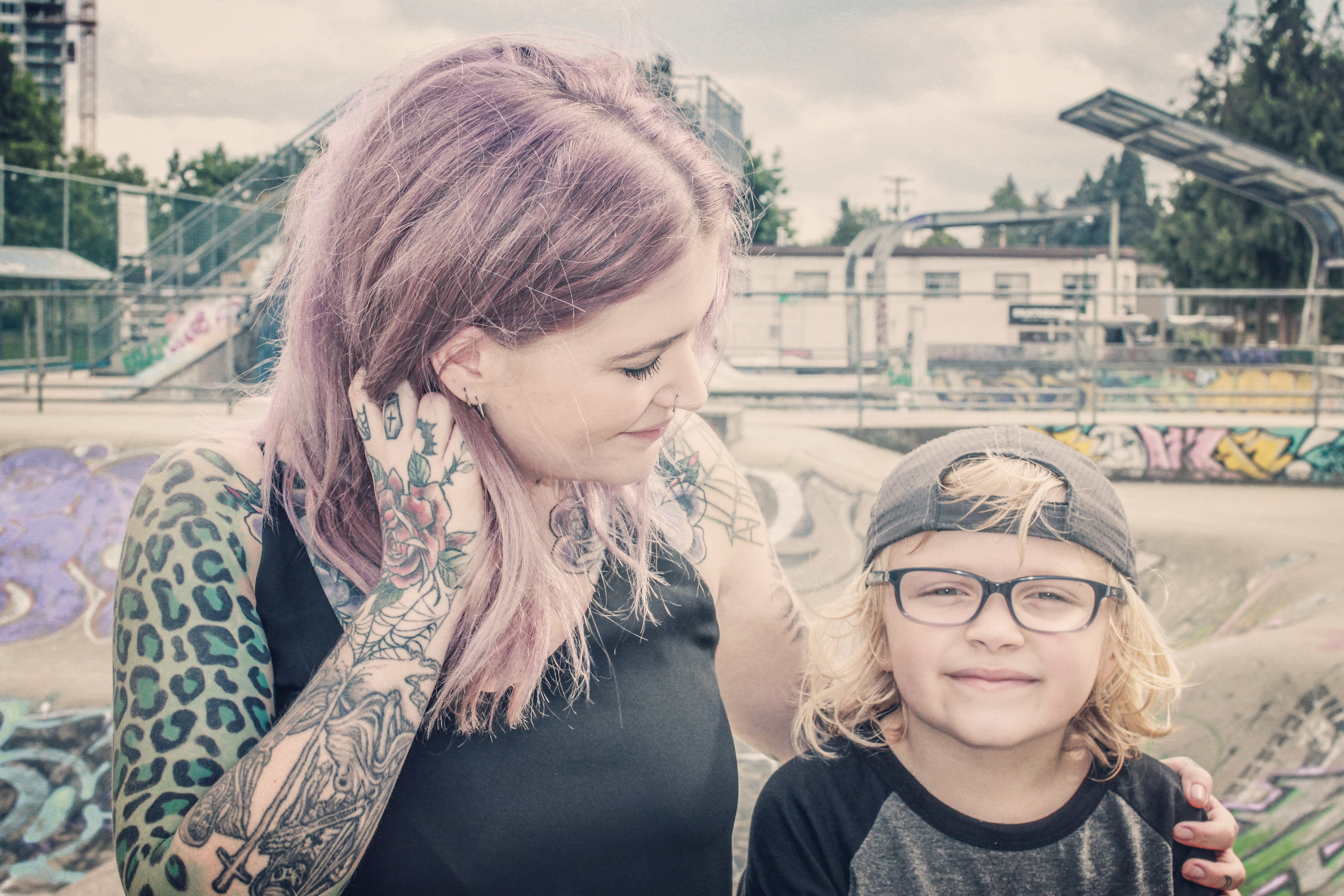 the author standing outside with her son and smiling at him